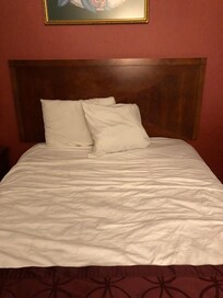 Bed looked like someone had been laying down on it