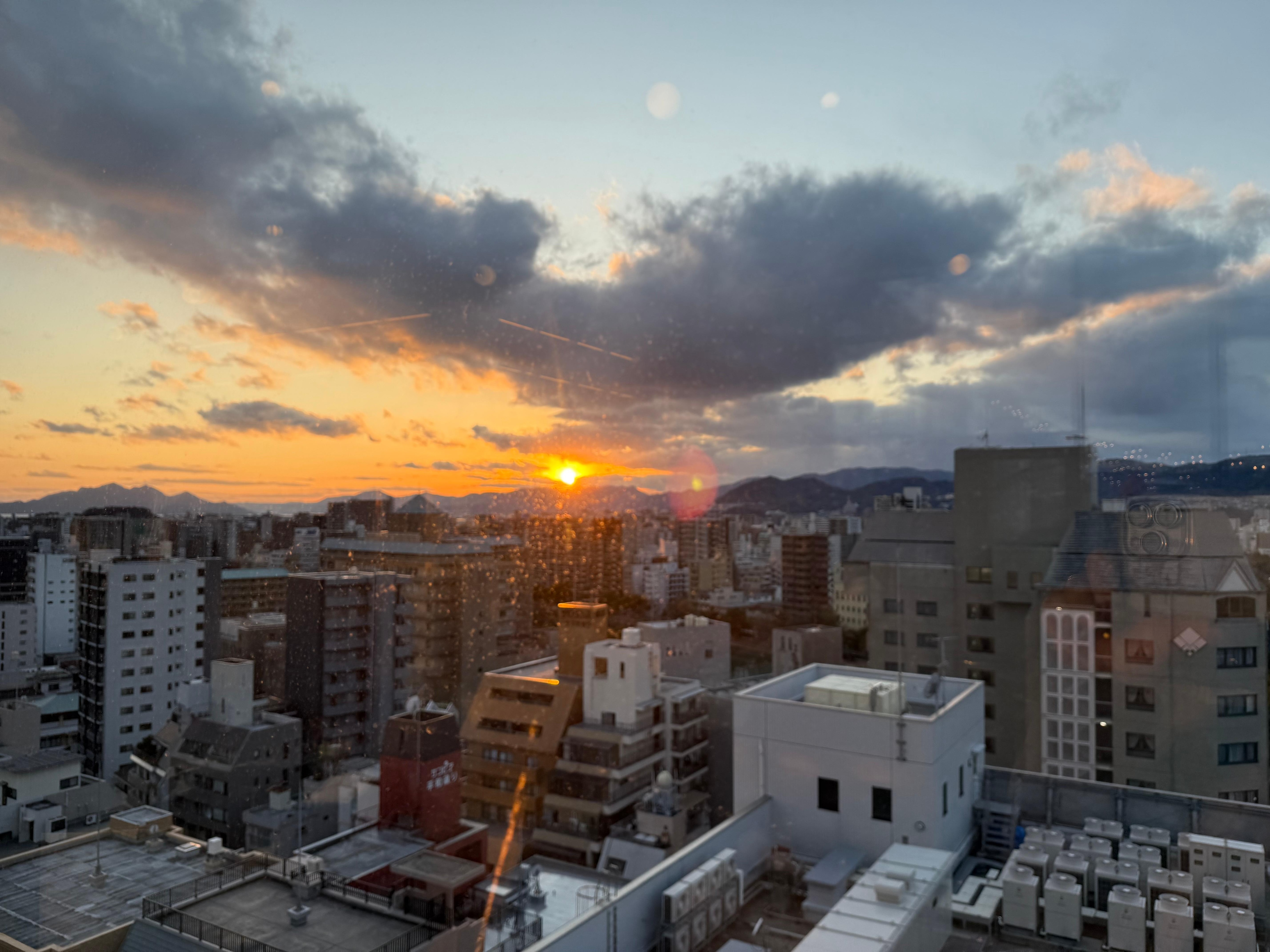 Watching sunset over couple drinks from top level of the hotel. 