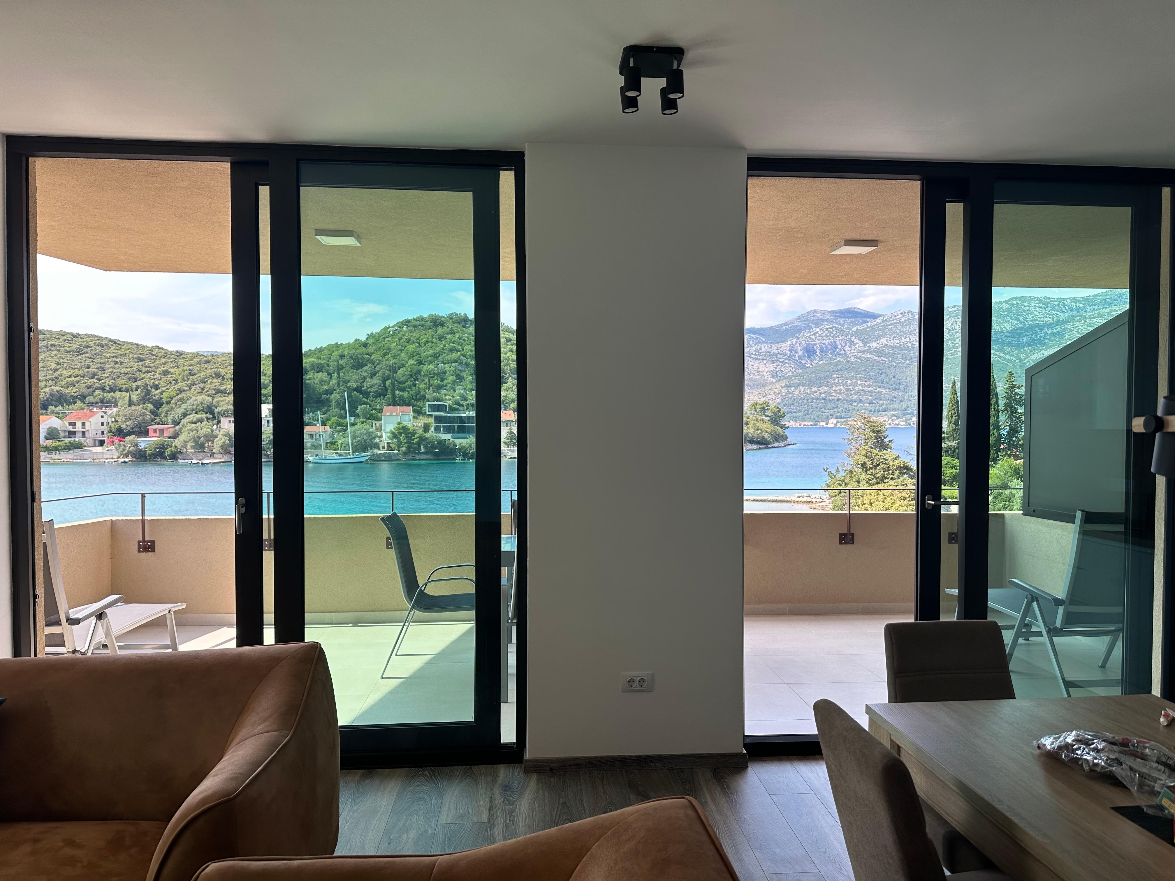 View looking out towards balcony from living room