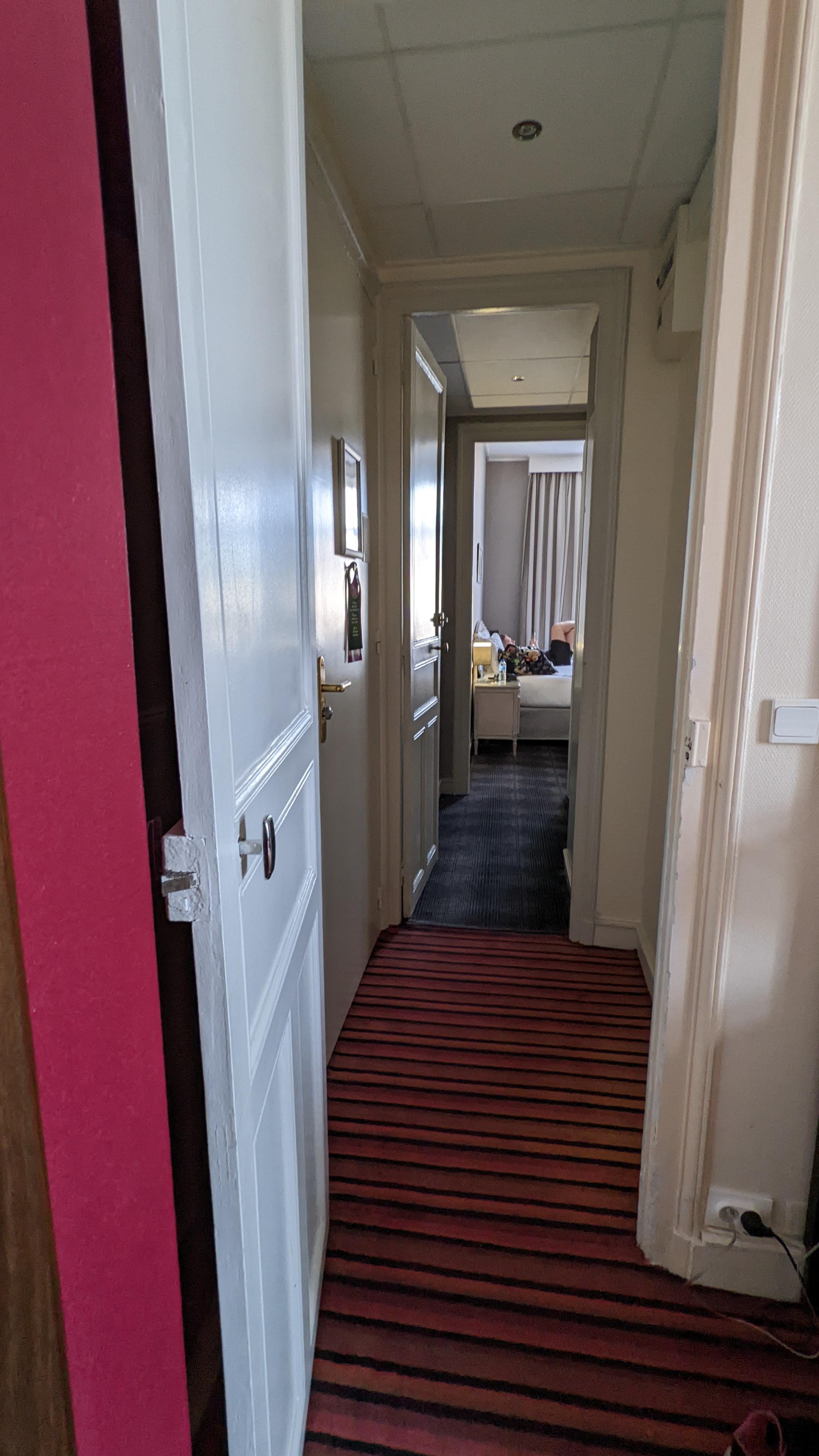 Adjoining corridor view back to Room 116