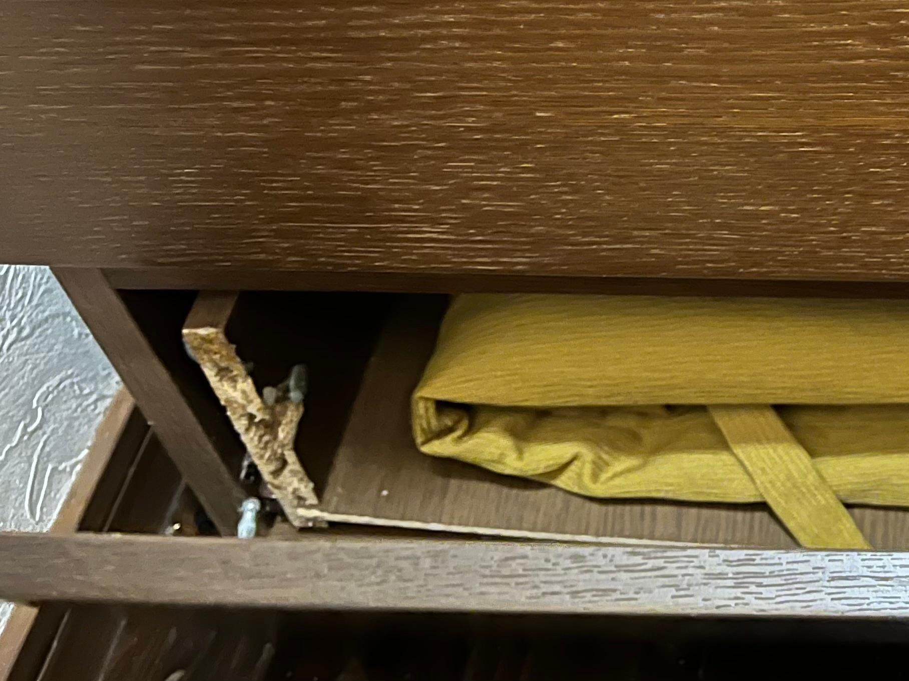 Broken drawer with nail sticking out