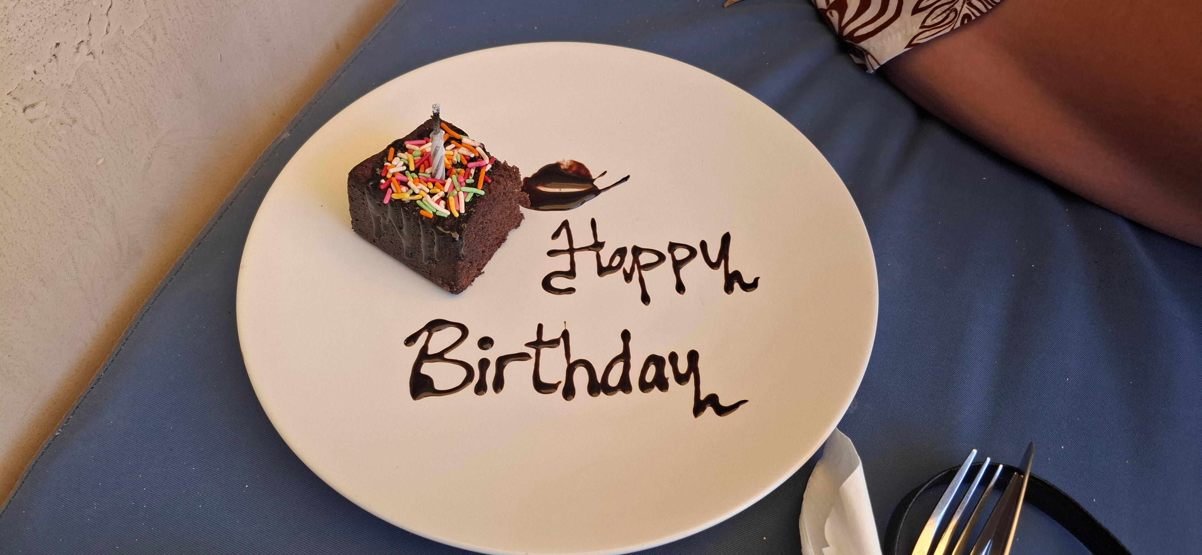 Complimentary birthday cake for my partner along with a birthday song and dance by the staff.