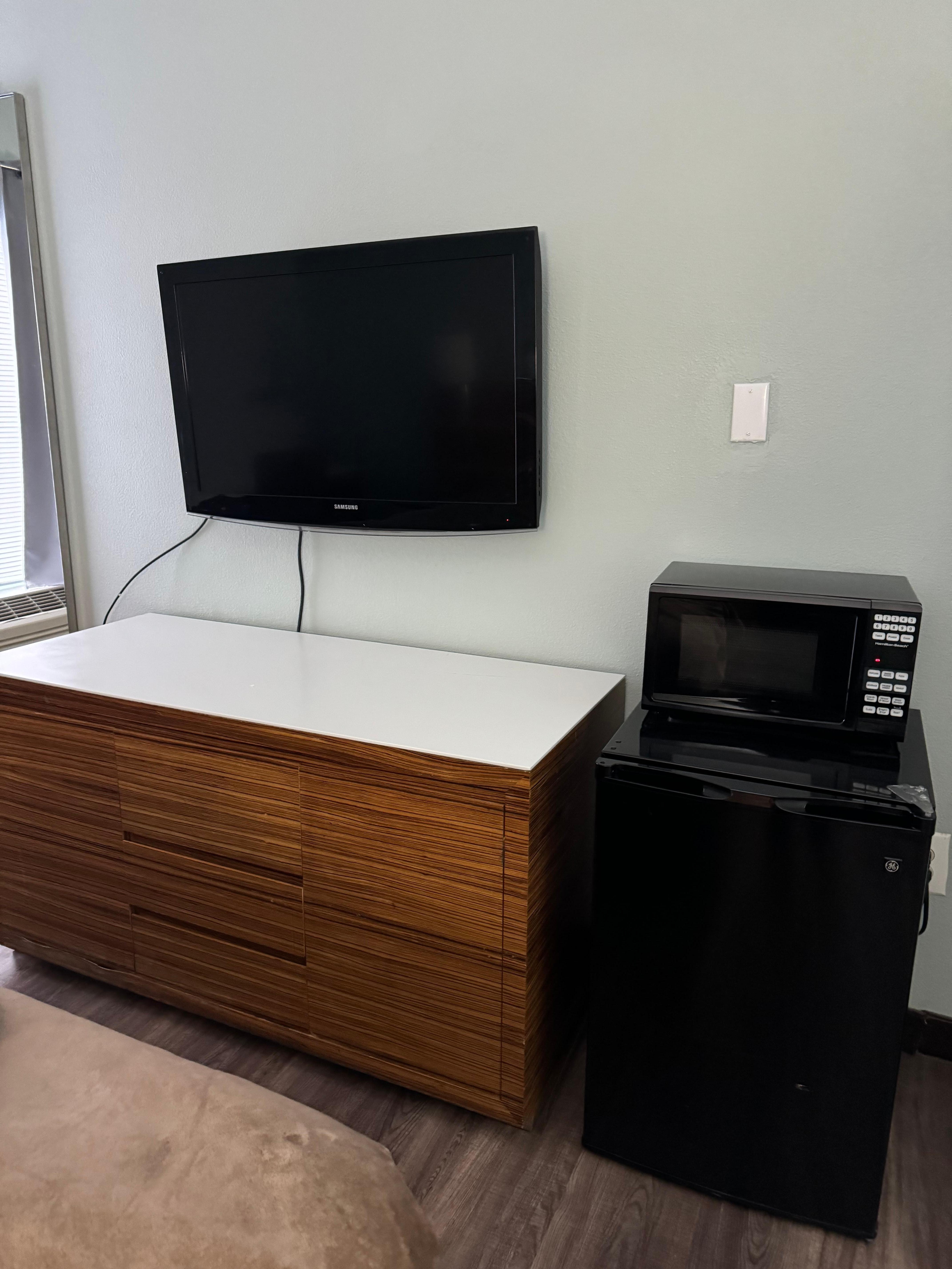 TV has lots of channels. Microwave and fridge. 