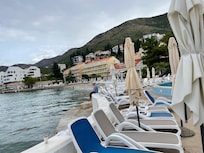 Swimming pool chairs and umbrellas.