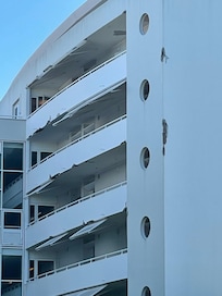 Concrete chunks falling off building .