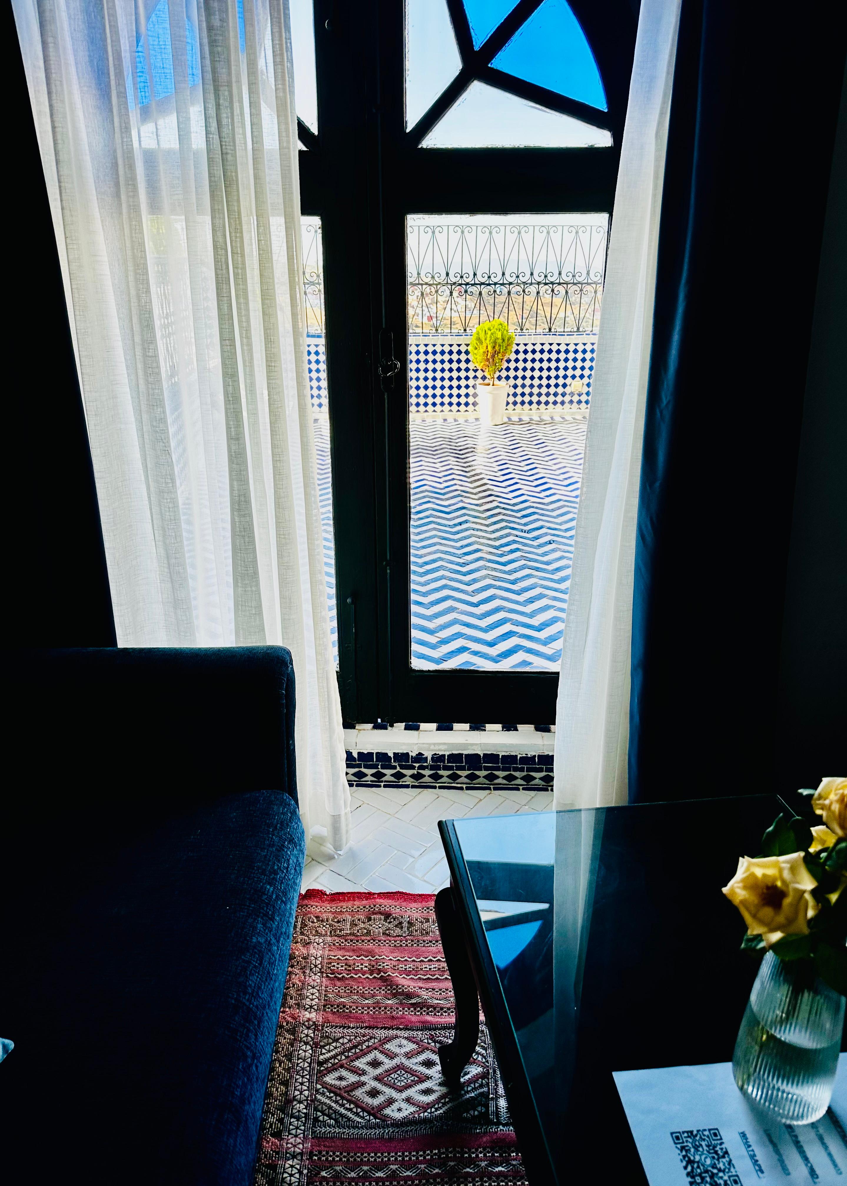 A sitting area-separate of the bed was framed by this lovely window and view 