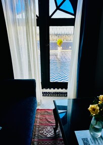 A sitting area-separate of the bed was framed by this lovely window and view