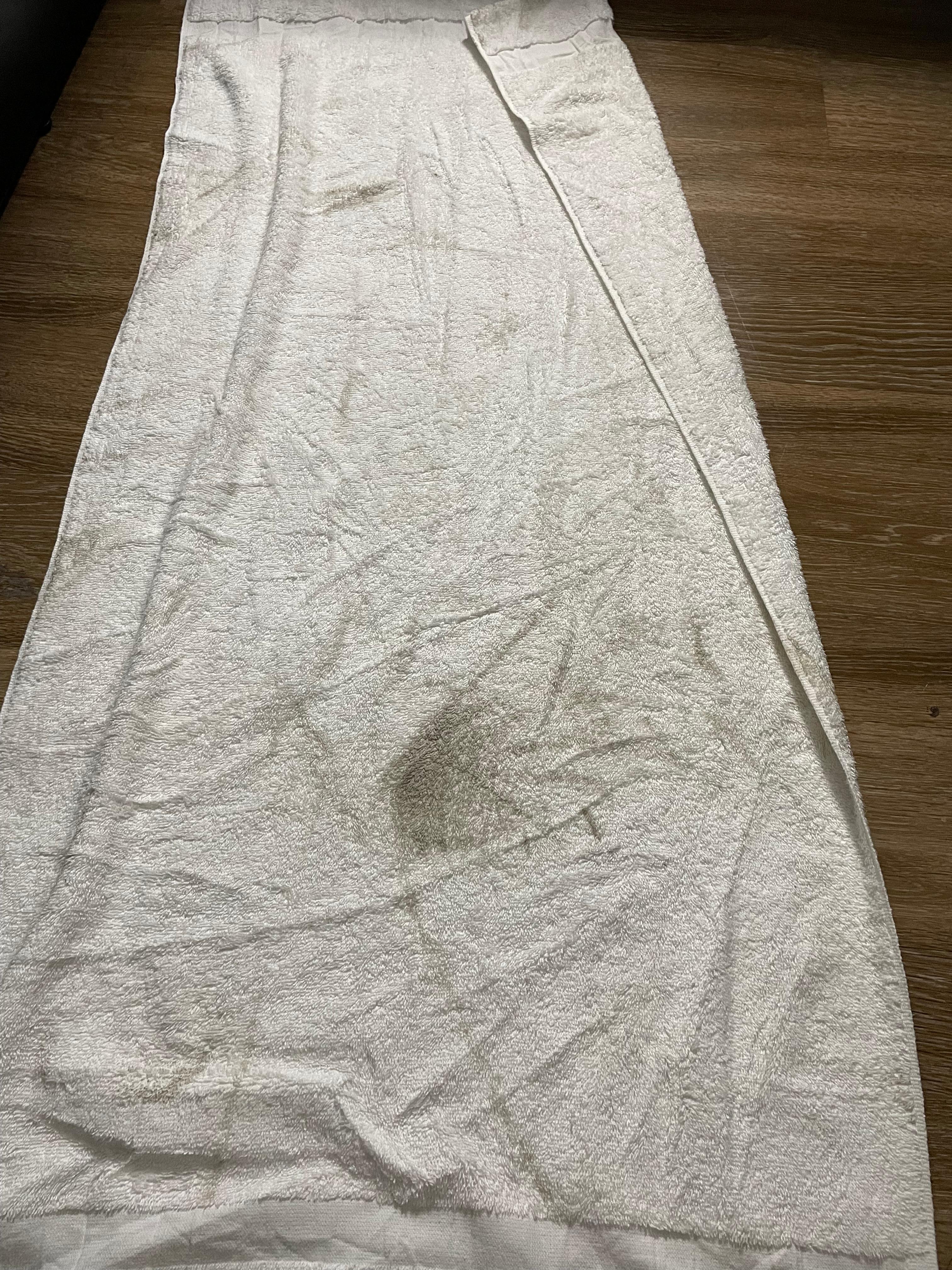 Towel that we used to step out of bed onto because of the dirty floors