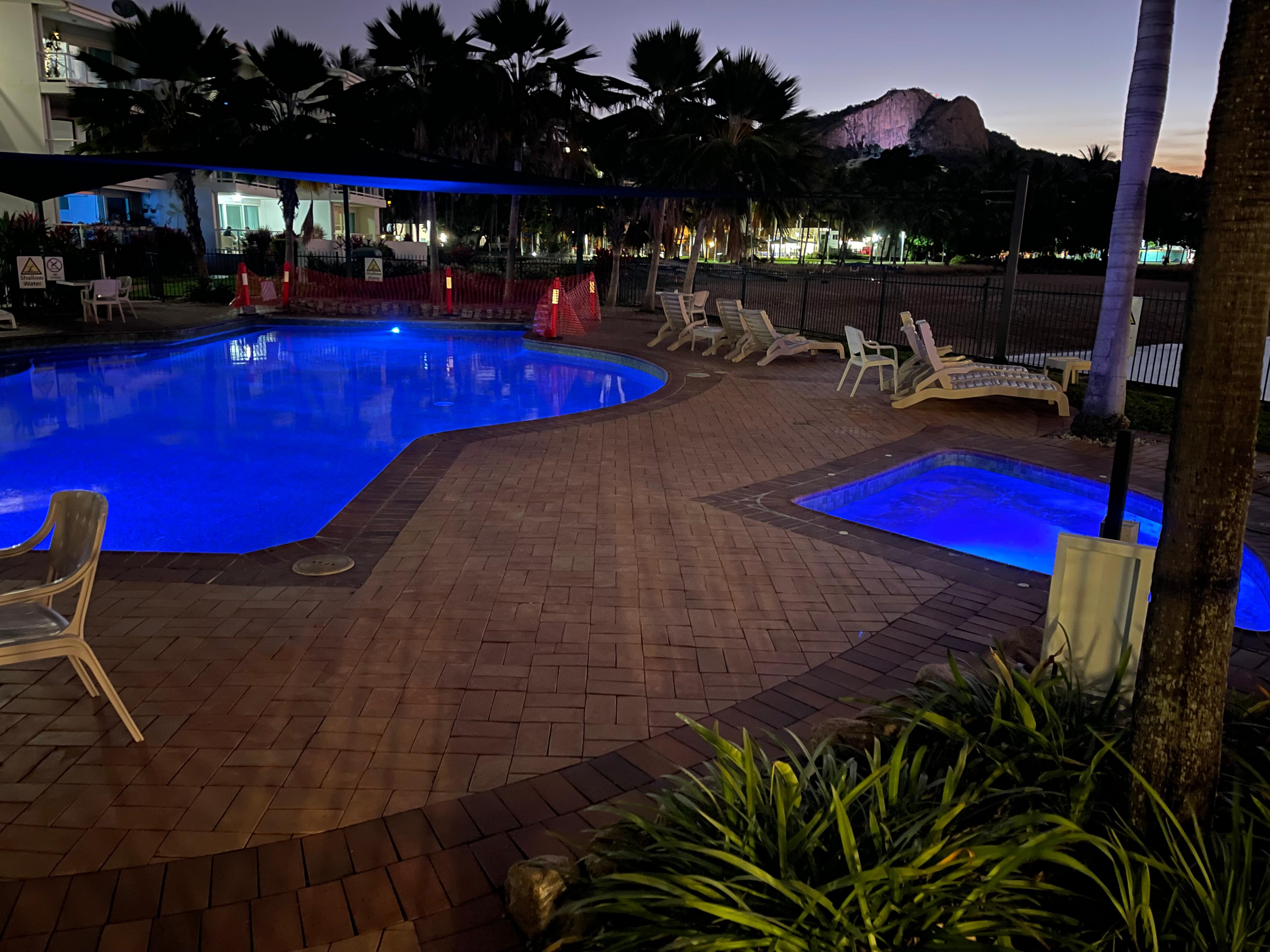 Night view of the pool and heated spa. 