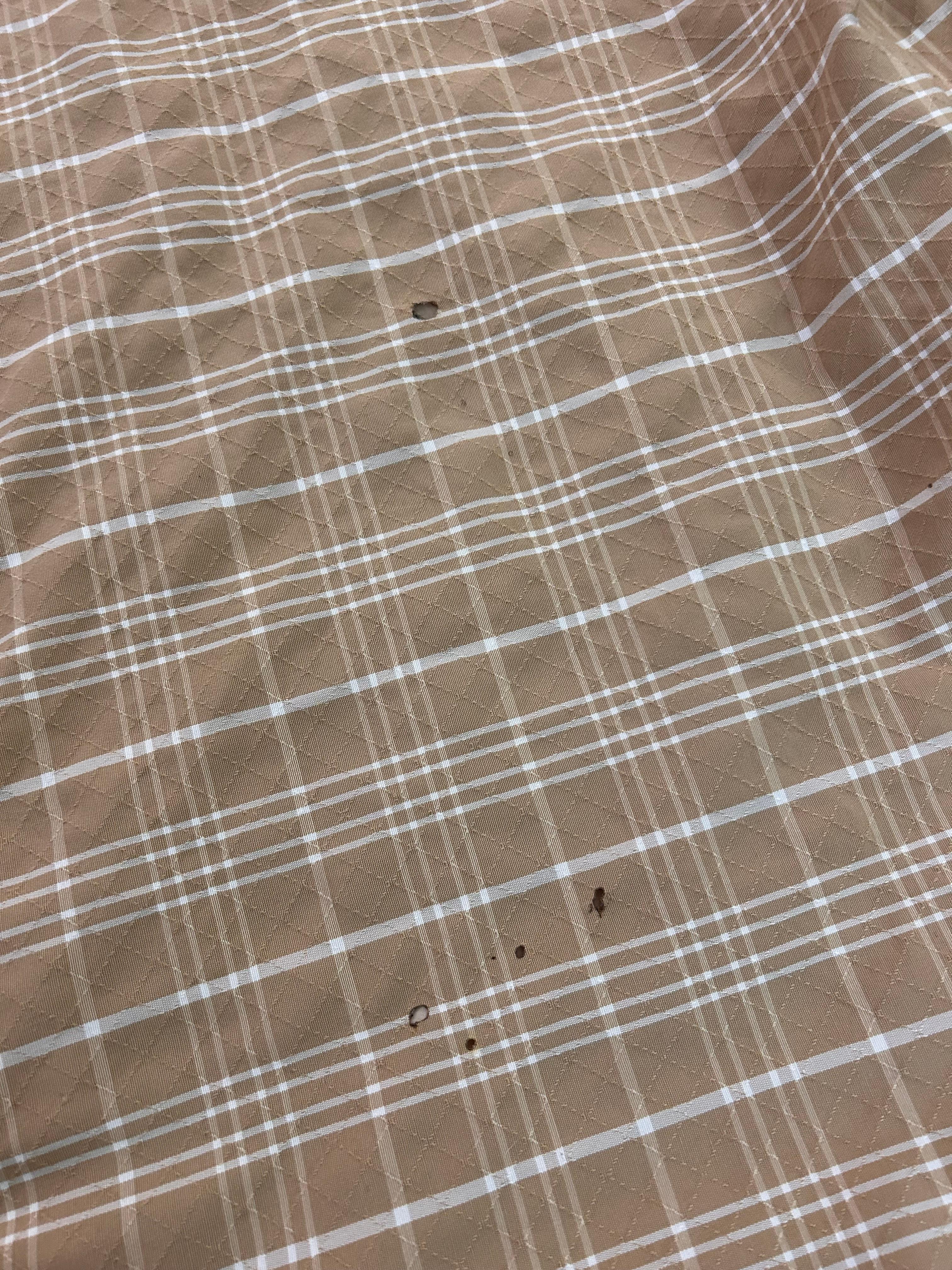 Cigarette burn holes