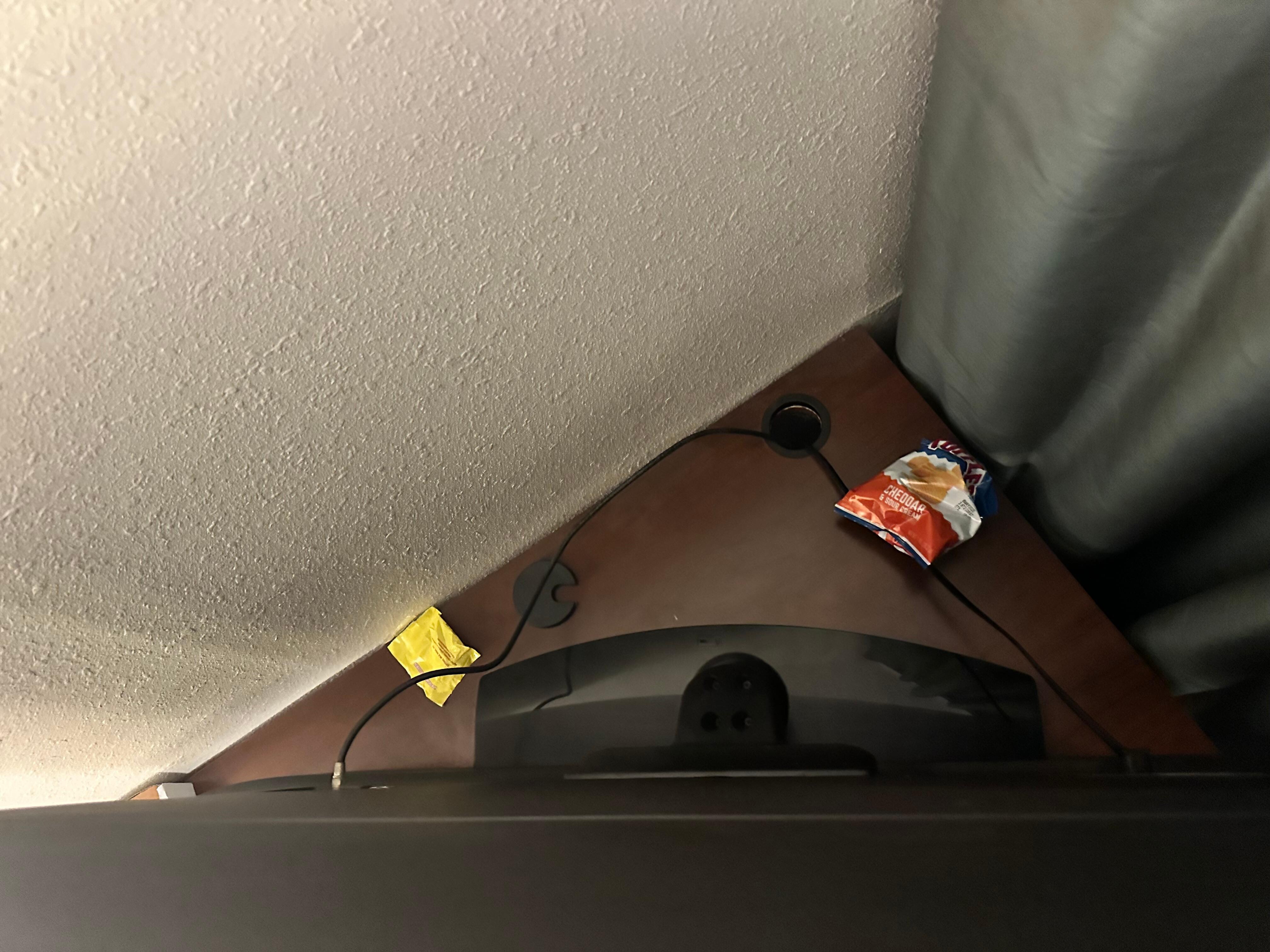 Trash not cleaned from behind tv