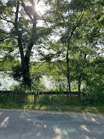 Opposite the river
