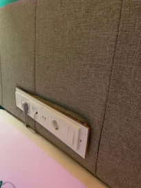 Outlets and light switches on the headboard