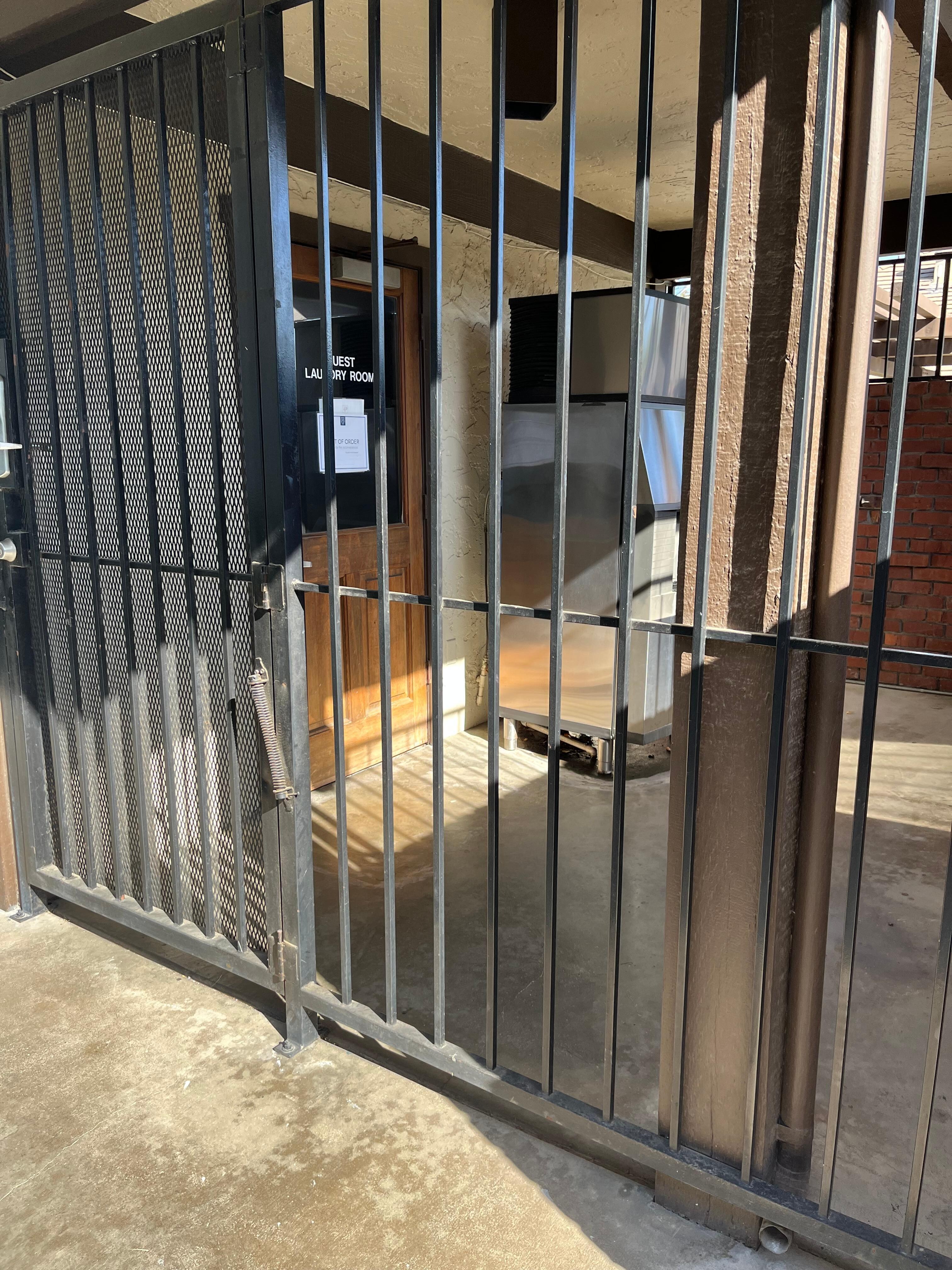 Locked up ice machine and entrance to inoperative laundry room