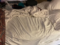 No flat sheet or blanket. Only fitted mattress sheet and thin bedspread on both beds.
