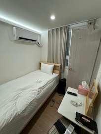 The single bedroom. Tiny but it works