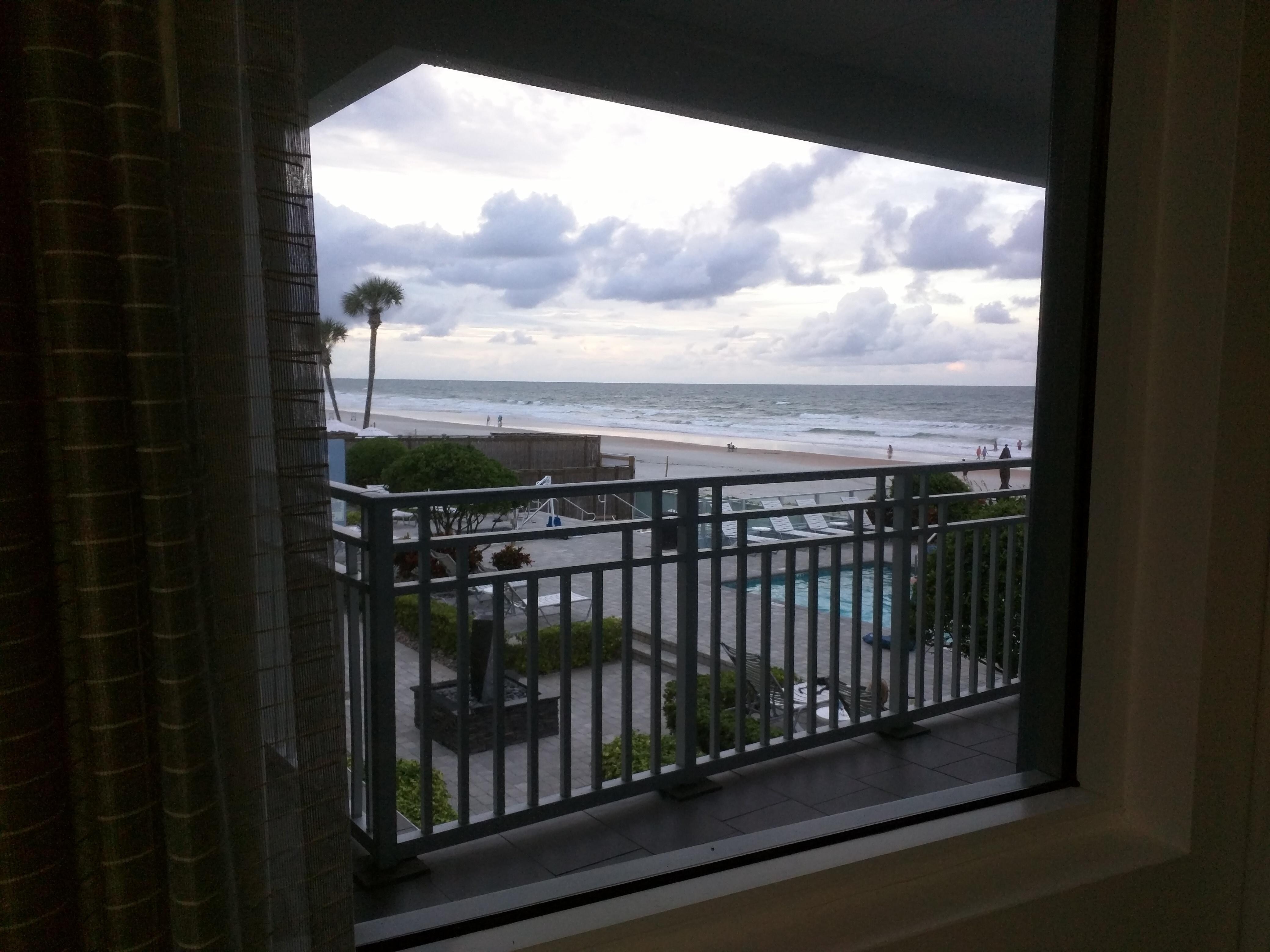 View of pool and ocean from outside door