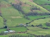 View of Celyn Farm from the top of Sugar Loaf.