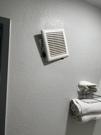 Vent hanging off the wall