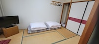 Futon beds, comfortable. It is an older hotel, so you have limited electrical outlets (2). Daily clean towels delivered to room in a basket.