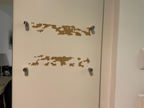 Something had been pulled off the back of the door.