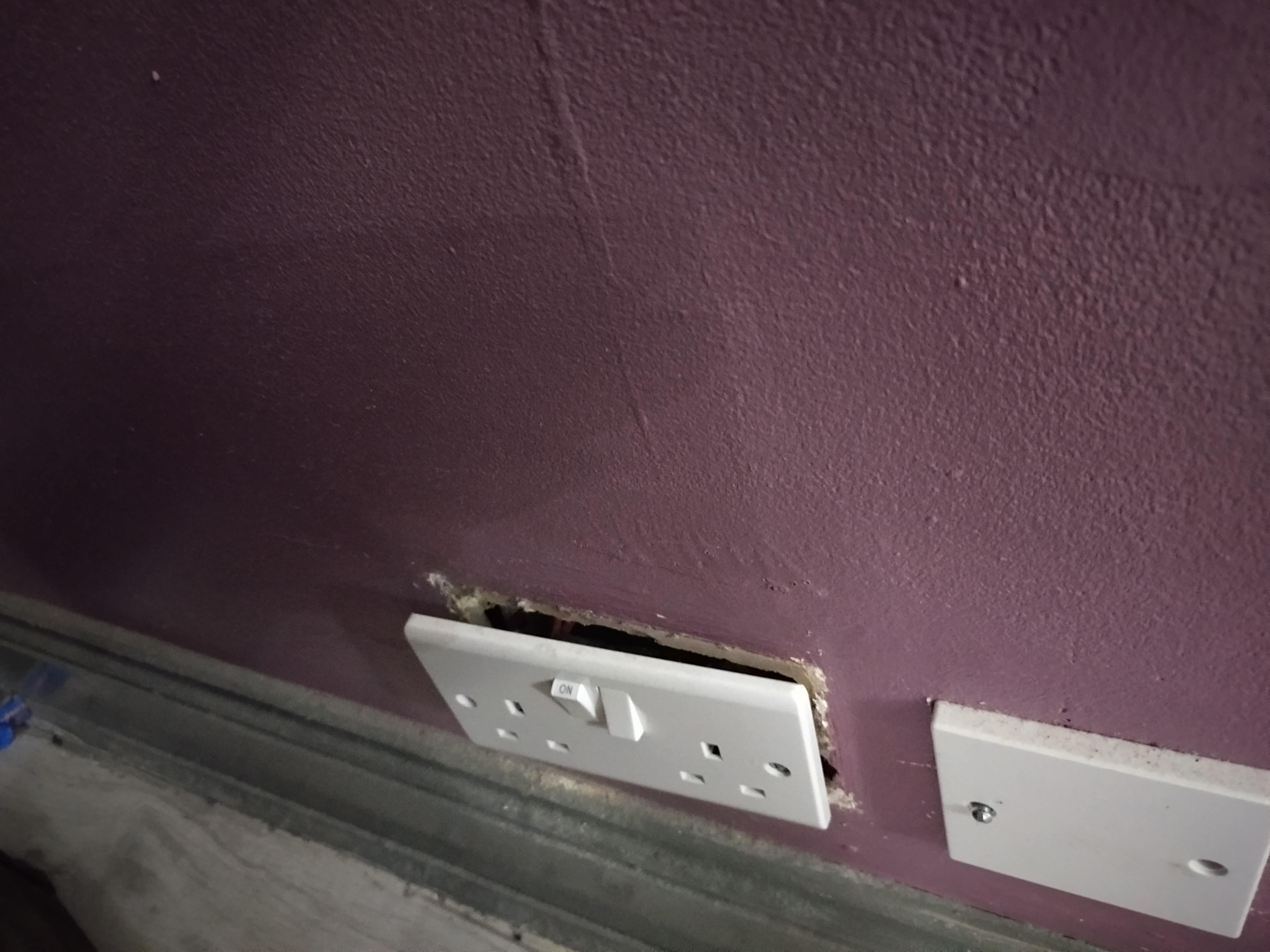 Socket hanging off in Room 