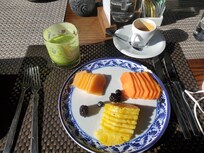 Fresh fruit, green juice, espresso for breakfast