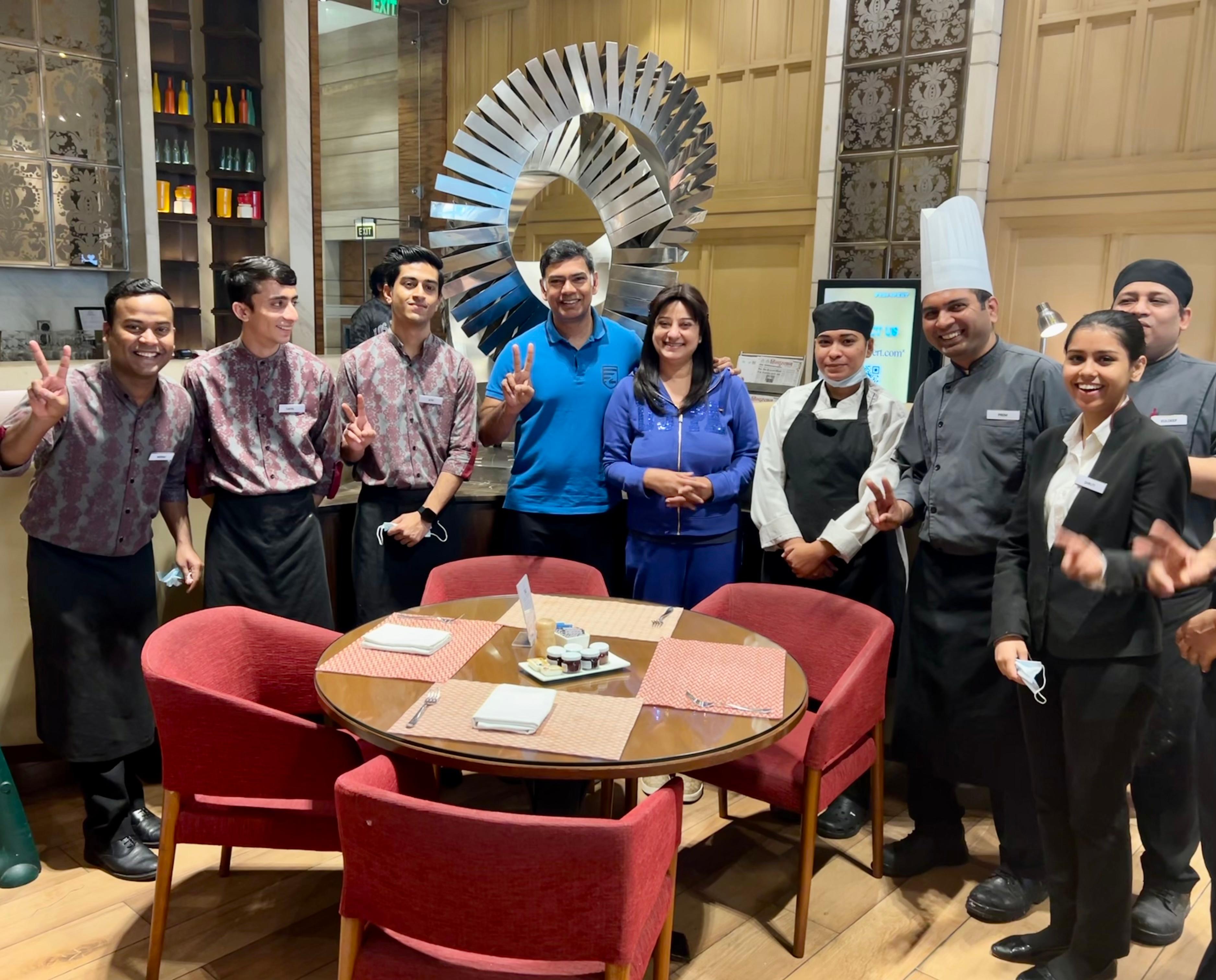 With the caring staff at breakfast buffet