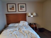 Bed so close to the wall made it hard to get into bed on that side; plenty of room to center bed and have a nightstand/lights on both sides of bed.