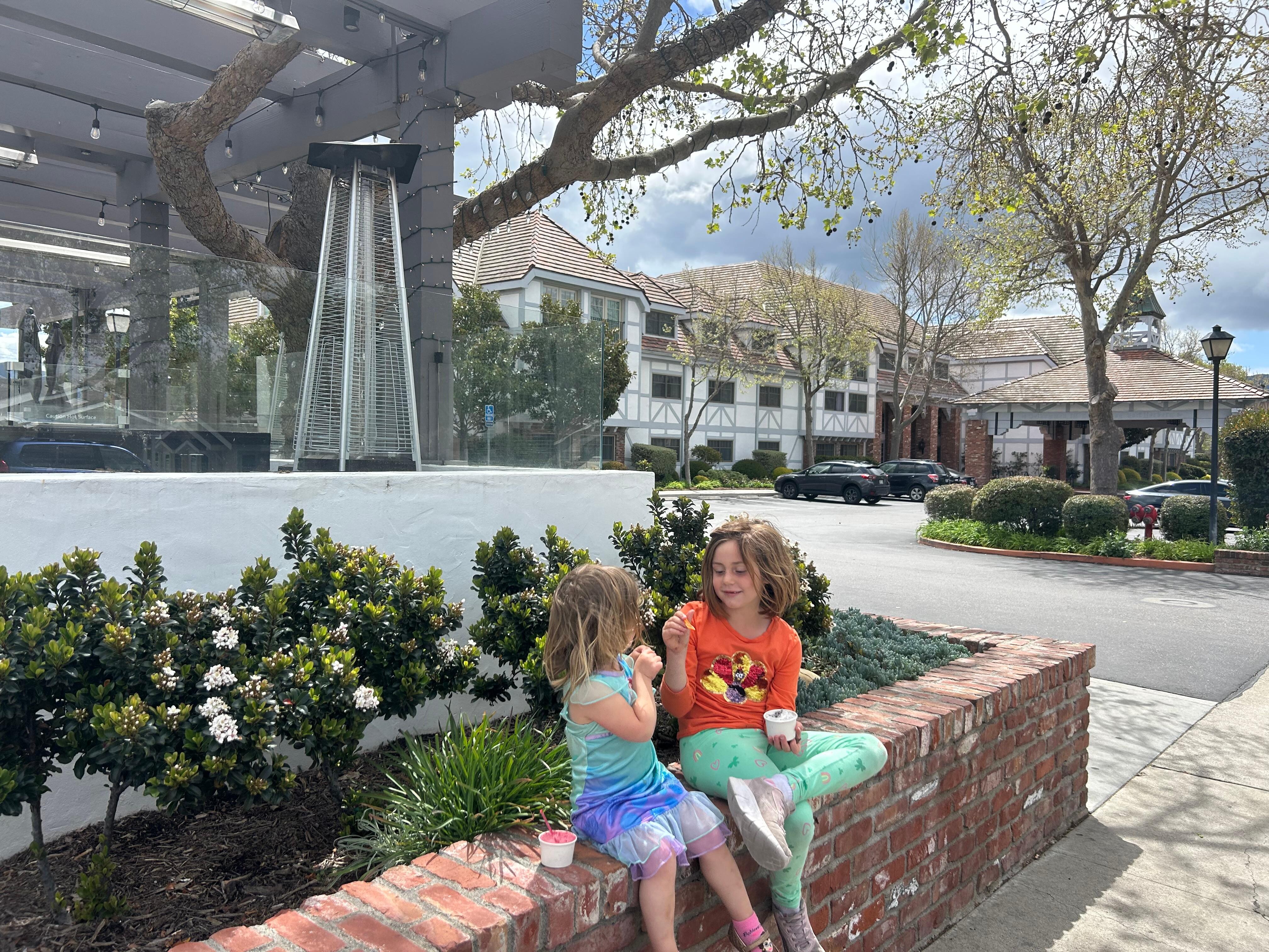 Enjoying Solvang ice cream and pastries with Corque in background