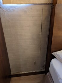 peeling wallpaper and damaged wall