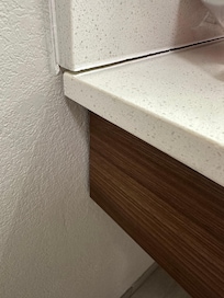 Coming off wall and loose bathroom counter
