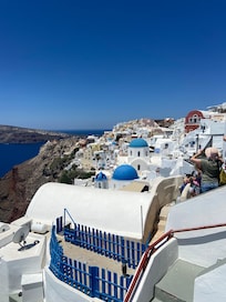 Classic view of Oia . Hotel is on this cliff face