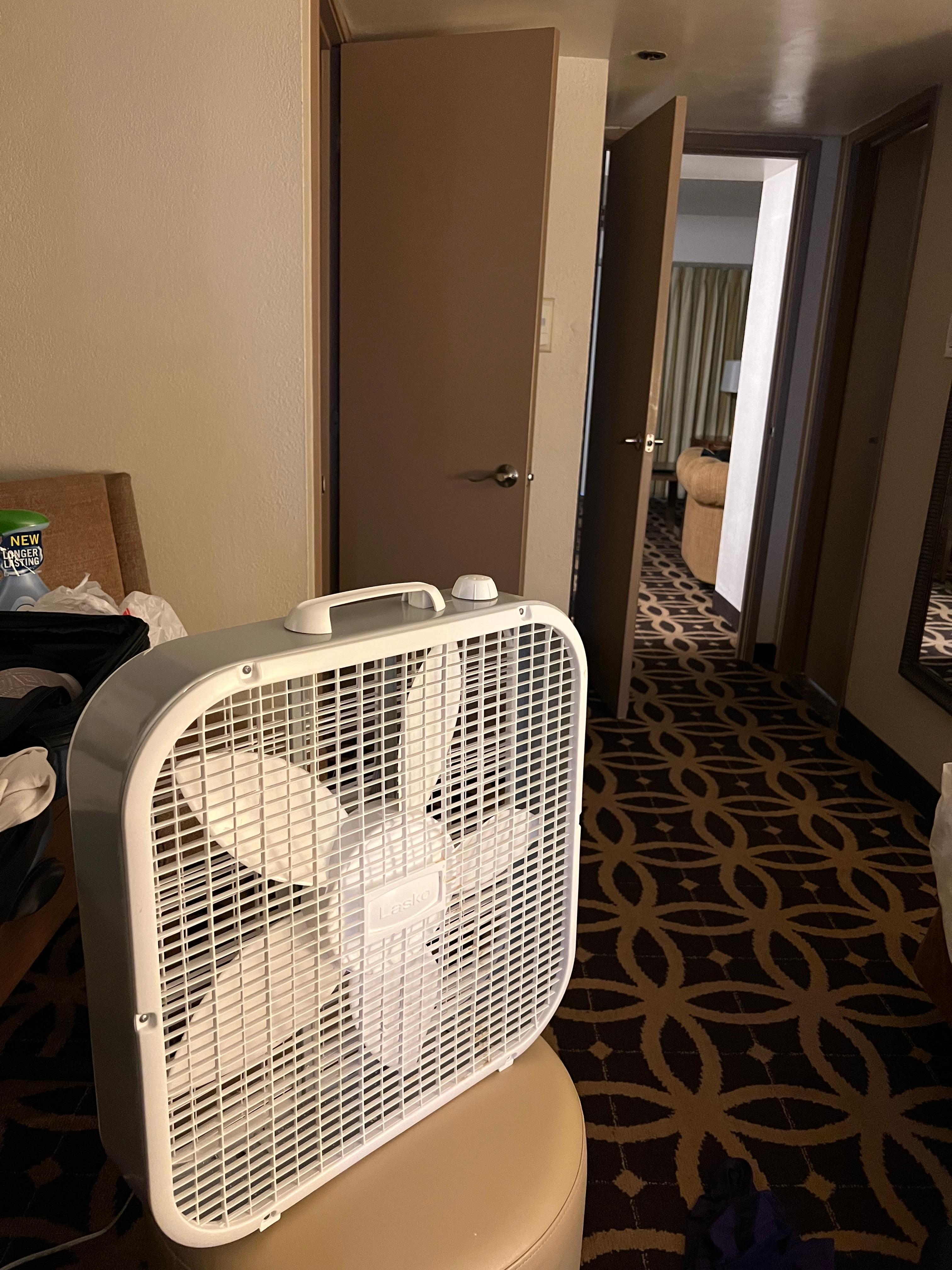 Box fan in room, possibly because previous visitors complained of how warm the hotel was.