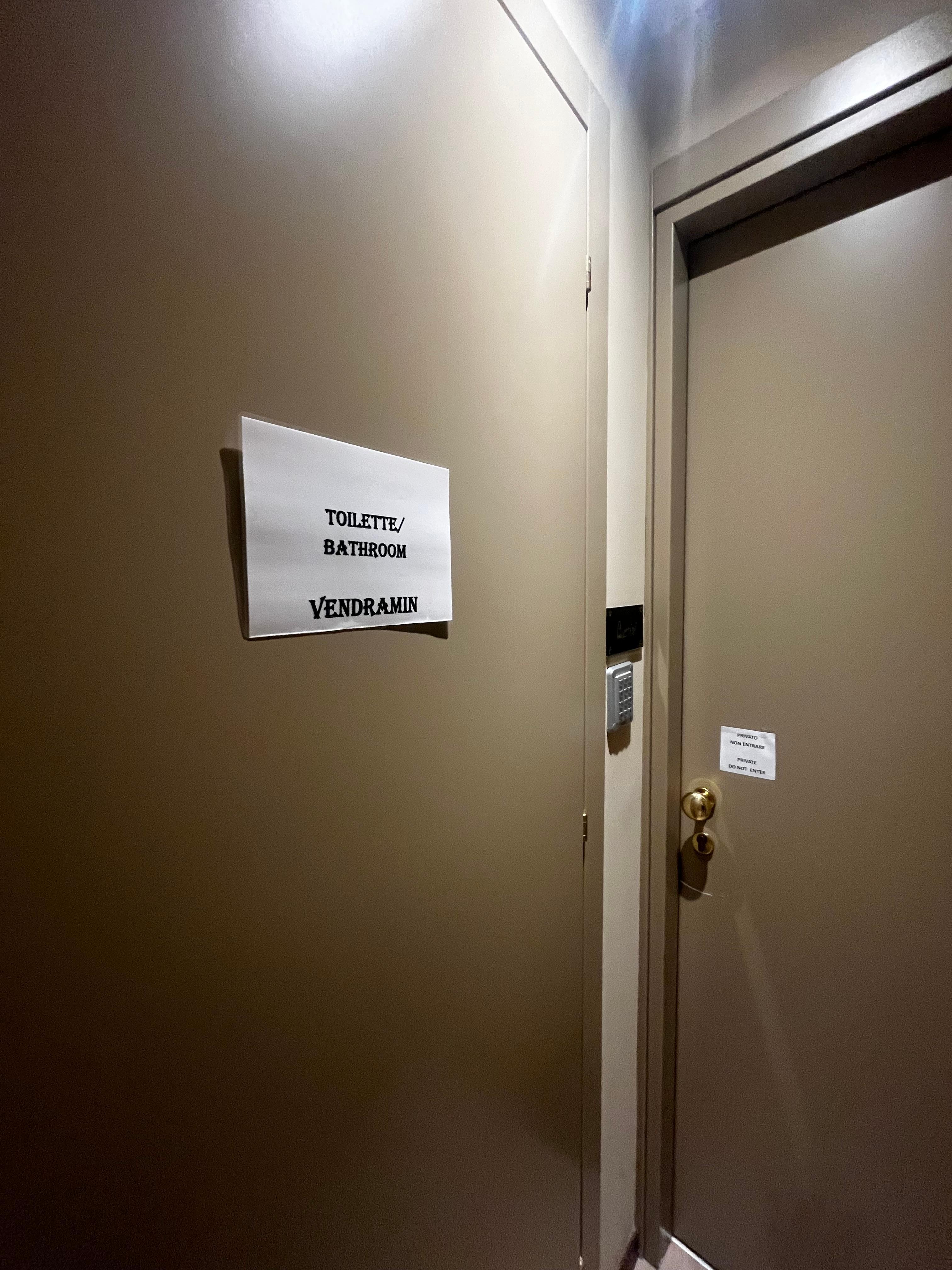 Entry door in front of the toilet door.