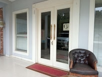 Front door locked. Dark inside. No electricity, no decor, nothing. Very dusty like an abandoned house.