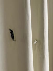 Holes in the curtains.
