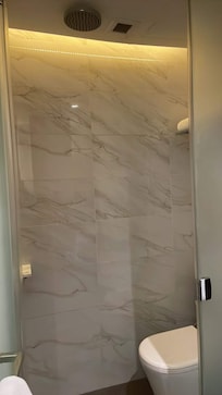 “Private bathroom” was smaller than a normal toilet. When we were in the shower, the water went everywhere, and you had to wipe everything down after with the 1 towel they provided per person.