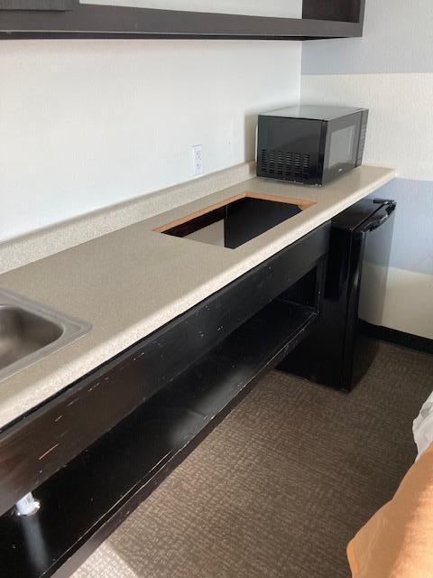 Missing sink and filthy countertop