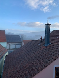 Looking out of the window of the room.