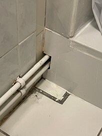 Not clean, not nice, cracks and spiders. Mirrow behind the toilet (bend over wc to do make-up?)