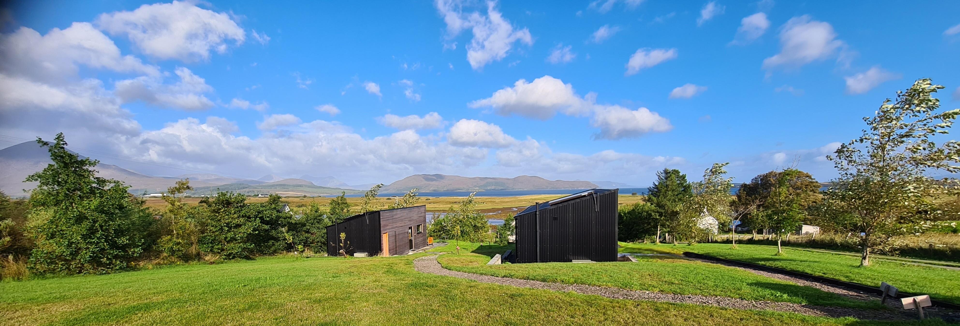 View behind both cabins out to sea 