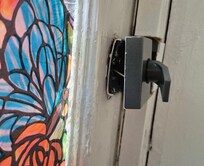 Rear door lock hanging off