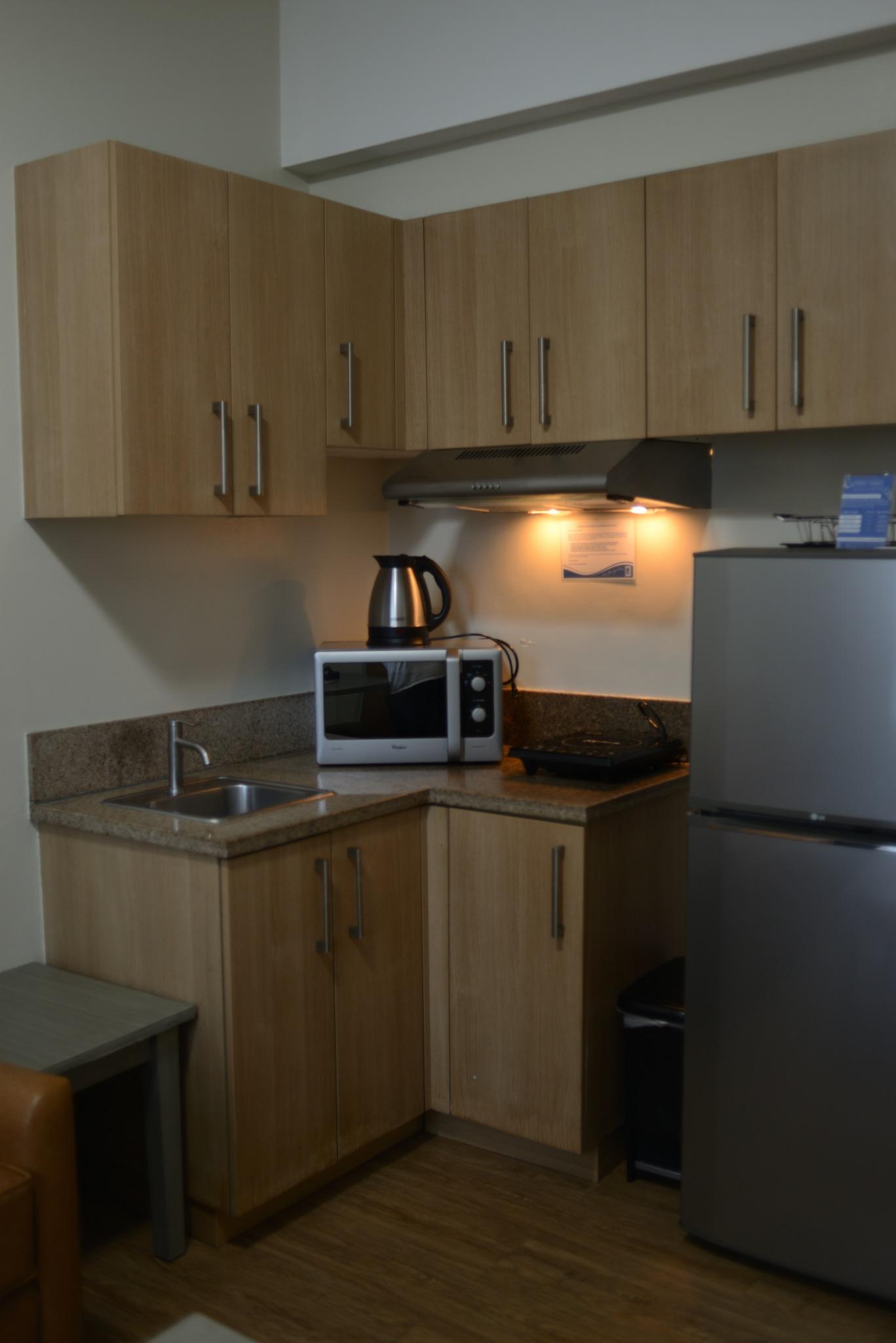 Microwave and fridge in kitchenette