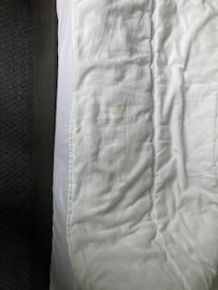 Extremely badly stained duvet.