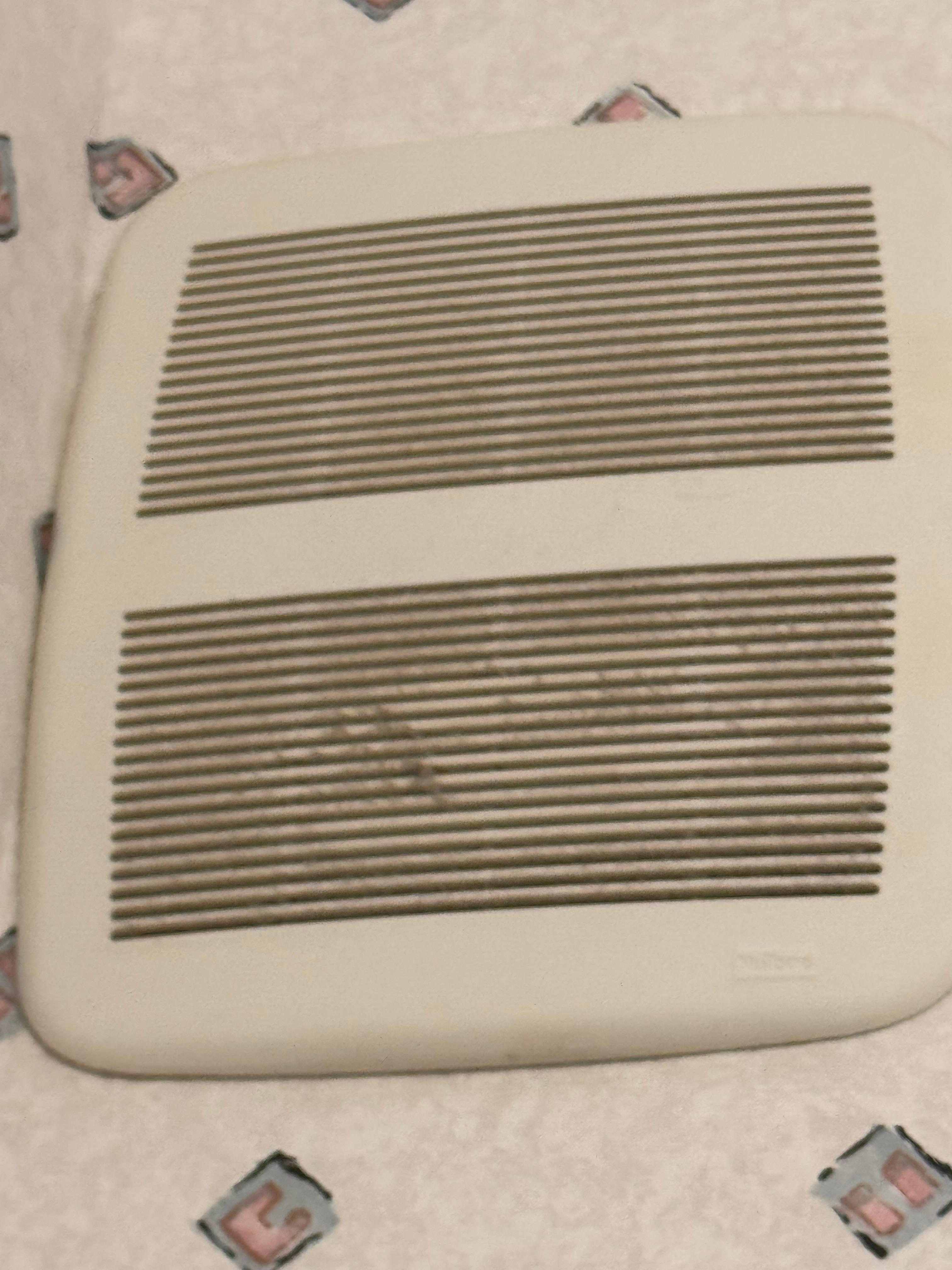 This was the vent in the bathroom, it was not on the ceiling. This is reachable by hand on the wall, and should have been cleaned between visits. Filthy.