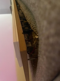 Broken electrical outlet on the headboard