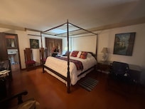 Spacious bed and living area.