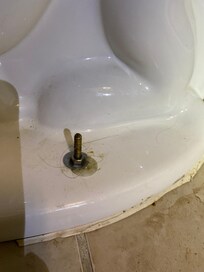 Filthy bathroom, toilet base.