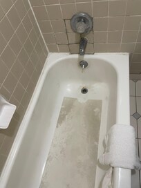 Bathtub was a horror show - from the grime to the collapsed tile.